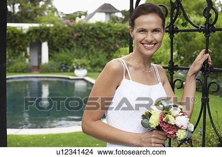 Picture - Happy Bride in Garden. Fotosearch