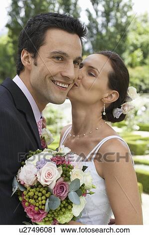 Stock Image - Happy Wedding Couple Outdoors. Fotosearch