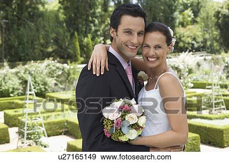 Stock Photo - Happy Wedding Couple Outdoors. Fotosearch
