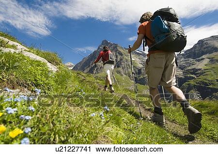 Stock Image - Hiking in the Val de Bagnes on the La Tsessette hiking trail, Canton du Valais. Fotosearch