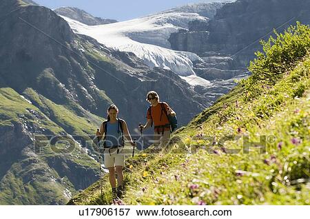 Stock Photo - Hiking in the Val de Bagnes on the La Tsessette hiking trail, Canton du Valais. Fotosearch