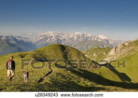 Hiking in Verbier in the Canton du Valais with views towards Italy and France View Large Photo Image Stock Image - Hiking in Verbier in the Canton du Valais with views towards Italy and France. Fotosearch