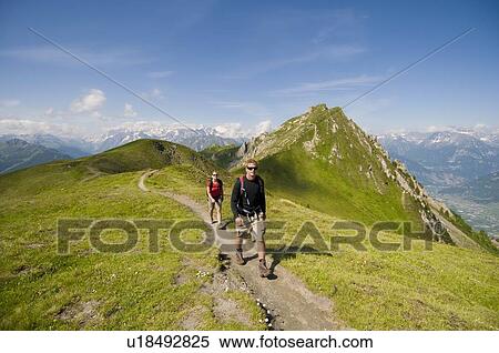 Stock Photography - Hiking in Verbier, Switzerland above the Rhone Valley. Fotosearch