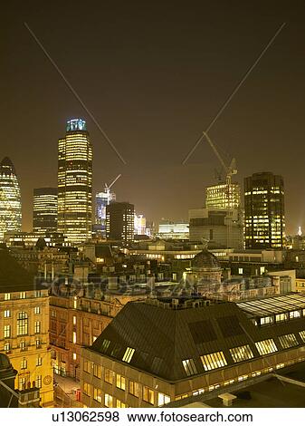 Illuminated cityscape with cranes at night View Large Photo Image Stock Photo - Illuminated cityscape with cranes at night. Fotosearch