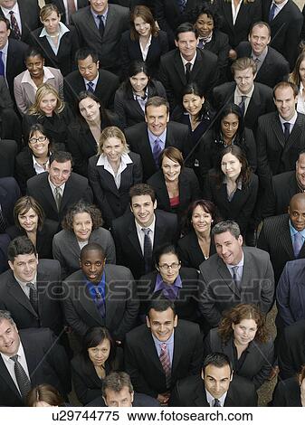 Stock Photography - Large group of business people looking up, portrait, elevated view. Fotosearch