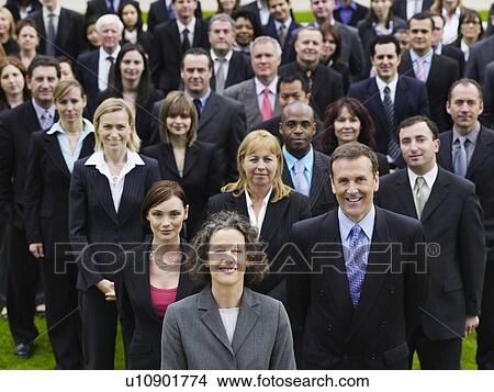 Picture - Large group of business people standing on lawn, portrait, elevated view. Fotosearch