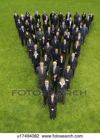 Large group of business people standing in triangle formation, elevated view View Large Photo Image Stock Image - Large group of business people standing in triangle formation, elevated view. Fotosearch
