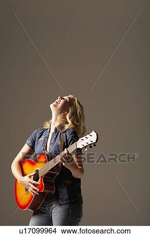 Laughing Woman Playing Guitar View Large Photo Image Picture - Laughing Woman Playing Guitar. Fotosearch