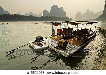 Stock Image - Li River and Karst hills in XinPing, Yangshuo, Guilin area, Guangxi province, China. Fotosearch