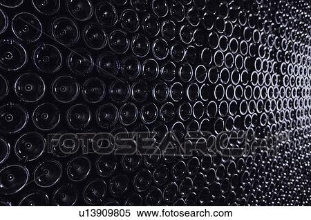 Lying down, arranged bottles of wine, bottom visible View Large Photo Image Stock Photography - Lying down, arranged bottles of wine, bottom visible. Fotosearch
