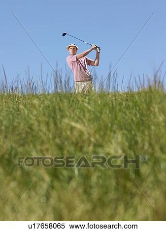 Male golfer driving ball View Large Photo Image Stock Photography - Male golfer driving ball. Fotosearch