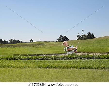 Male golfer in sand trap View Large Photo Image Picture - Male golfer in sand trap. Fotosearch
