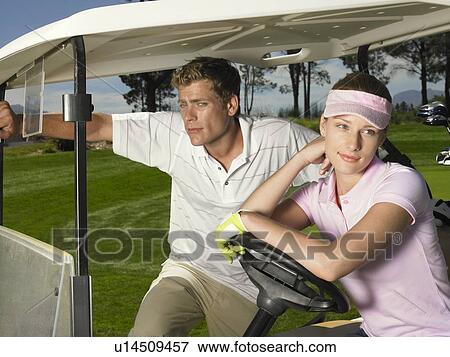Man and Woman in Golf Cart View Large Photo Image Stock Photo - Man and Woman in Golf Cart. Fotosearch