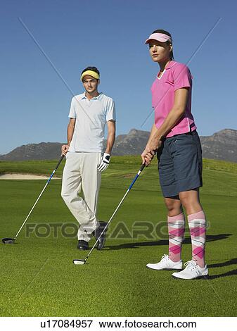 Man and Woman on Golf Course View Large Photo Image Stock Photo - Man and Woman on Golf Course. Fotosearch