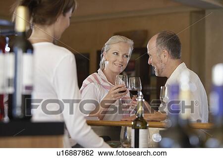 Man and woman wine-tasting, selective focus View Large Photo Image Stock Image - Man and woman wine-tasting, selective focus. Fotosearch