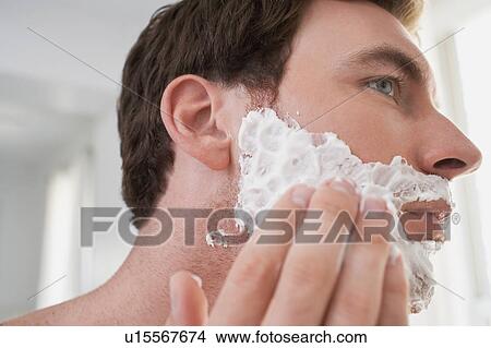 Man applying shaving cream, close-up View Large Photo Image Picture - Man applying shaving cream, close-up. Fotosearch