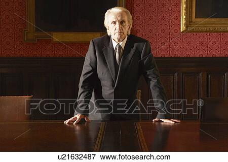 Stock Photo - Man at Conference Table. Fotosearch
