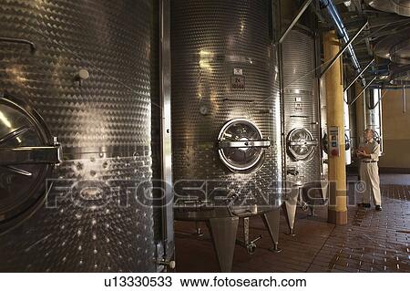Man examination wine vats View Large Photo Image Stock Image - Man examination wine vats. Fotosearch
