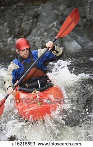 Man kayaking in river View Large Photo Image Stock Image - Man kayaking in river. Fotosearch