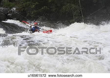 Man kayaking in river View Large Photo Image Stock Image - Man kayaking in river. Fotosearch