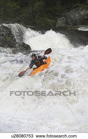 Man kayaking in river View Large Photo Image Stock Image - Man kayaking in river. Fotosearch
