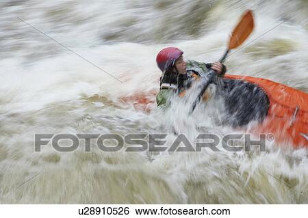 Man kayaking in river View Large Photo Image Stock Photograph - Man kayaking in river. Fotosearch