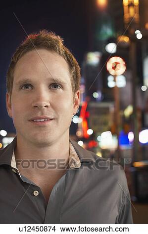 Man on Sidewalk at Night, close up View Large Photo Image Picture - Man on Sidewalk at Night, close up. Fotosearch