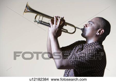 Man Playing Trumpet, close-up, side view View Large Photo Image Picture - Man Playing Trumpet, close-up, side view. Fotosearch