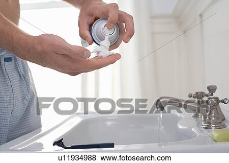 Man preparing to shave at bathroom sink, mid section View Large Photo Image Stock Photo - Man preparing to shave at bathroom sink, mid section. Fotosearch