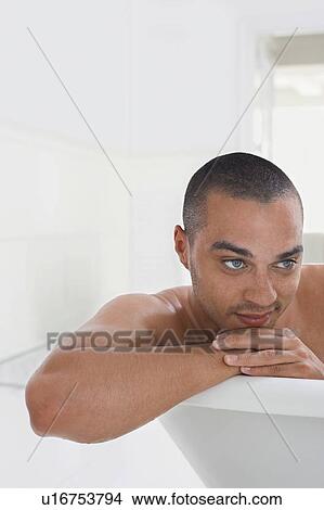 Man relaxing in bathtub View Large Photo Image Picture - Man relaxing in bathtub. Fotosearch