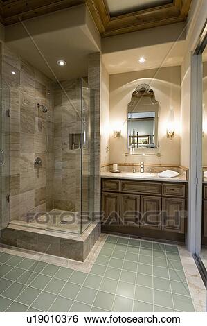 Stock Photograph - Marble shower cubicle with tiled green floor. Fotosearch