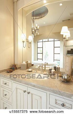 Marble topped cream bathroom with window reflected in mirror View Large Photo Image Stock Photography - Marble topped cream bathroom with window reflected in mirror. Fotosearch