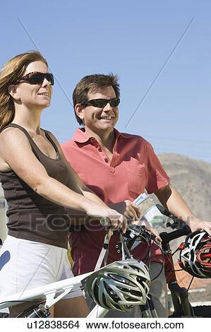 Mature couple on cycling holiday View Large Photo Image Picture - Mature couple on cycling holiday. Fotosearch