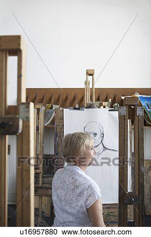 Mature woman in art studio smiling View Large Photo Image Stock Image - Mature woman in art studio smiling. Fotosearch