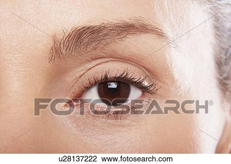 Stock Image - Middle-aged woman's eye. Fotosearch