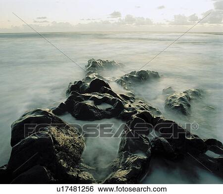 Mist among rocks at coast View Large Photo Image Stock Photograph - Mist among rocks at coast. Fotosearch