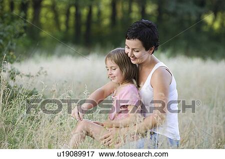 Stock Photo - Mother and Daughter in a Field. Fotosearch