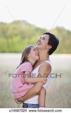 Mother and Daughter Laughing View Large Photo Image Picture - Mother and Daughter Laughing. Fotosearch