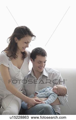 Mother and father with newborn baby View Large Photo Image Stock Image - Mother and father with newborn baby. Fotosearch