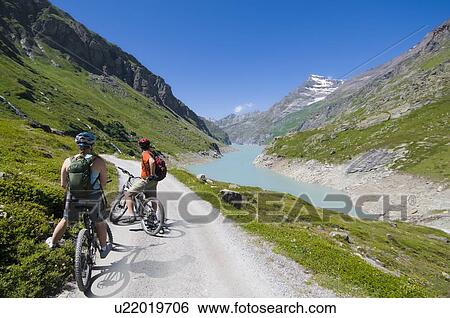 Stock Photograph - Mountain biking in the Val de Bagnes, Switzerland near the Cabane de Chanrion. Fotosearch