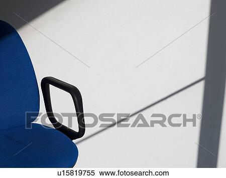 Office chair casting shadow on wall View Large Photo Image Stock Photography - Office chair casting shadow on wall. Fotosearch