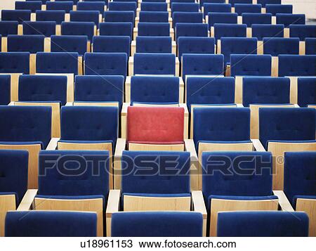 One Red Seat in large group of blue seats in auditorium View Large Photo Image Stock Image - One Red Seat in large group of blue seats in auditorium. Fotosearch