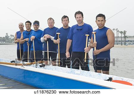 Stock Image - Outrigger canoeing team, group portrait. Fotosearch