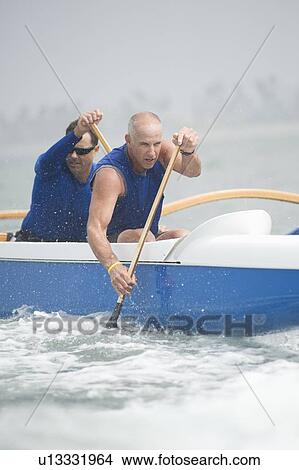 Outrigger canoeing team of two View Large Photo Image Picture - Outrigger canoeing team of two. Fotosearch