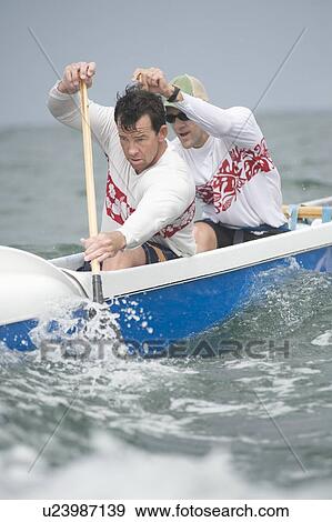 Stock Photo - Outrigger canoeing team of two. Fotosearch