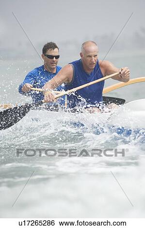 Stock Photograph - Outrigger canoeing team of two. Fotosearch