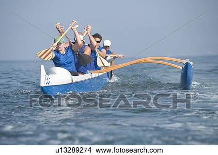Outrigger canoeing team on water View Large Photo Image Picture - Outrigger canoeing team on water. Fotosearch