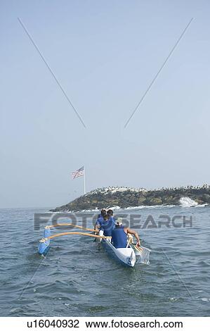 Outrigger canoeing team on water View Large Photo Image Stock Image - Outrigger canoeing team on water. Fotosearch