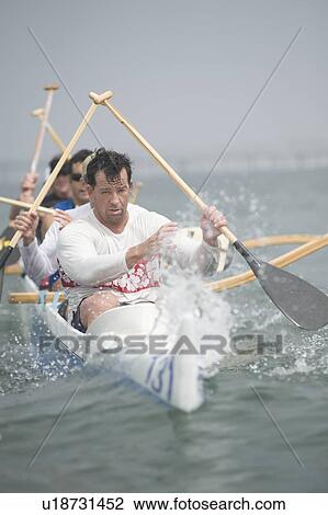 Outrigger canoeing team on water View Large Photo Image Stock Image - Outrigger canoeing team on water. Fotosearch