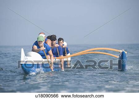 Outrigger canoeing team on water View Large Photo Image Stock Photograph - Outrigger canoeing team on water. Fotosearch